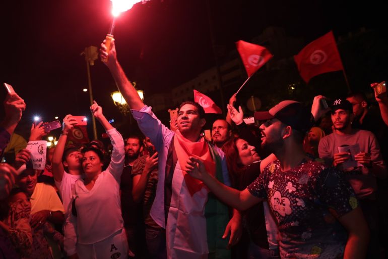 Tunisians gather to celebrate the victory of Tunisia’s independent candidate Kais Saied after he has secured more than 72% of votes in the presidential election held on Sunday