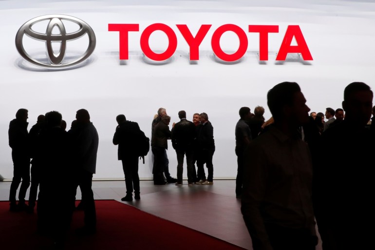 Visitors look at car models on the Toyota stand during the 88th Geneva International Motor Show in Geneva, Switzerland, March 7, 2018. REUTERS/Denis Balibouse