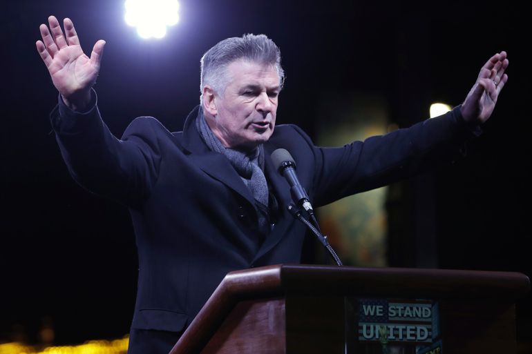 epa05732687 US actor Alec Baldwin speaks during a protest outside the Trump International Hotel and Tower in New York, New York, USA, 19 January 2017, one day before Donald J. Trump is sworn in as the 45th President of the United States in Washington DC. Trump won the 08 November 2016 election to become the next US President. EPA/JASON SZENES