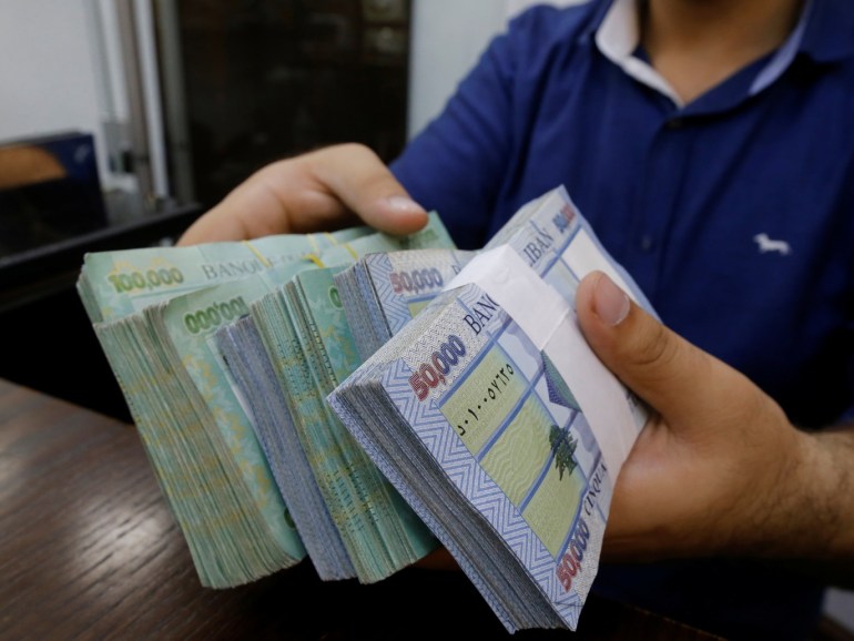 A money exchange vendor displays Lebanese pound banknotes at his shop in Beirut, Lebanon, November 8, 2017. REUTERS/Mohamed Azakir