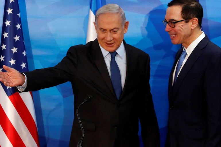 Israeli Prime Minister Benjamin Netanyahu gestures while standing next to U.S. Treasury Secretary Steven Mnuchin as they prepare to deliver joint statements during their meeting in Jerusalem October 28, 2019. REUTERS/Ronen Zvulun