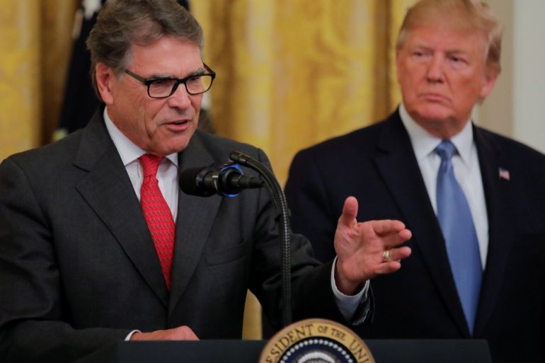 U.S. President Donald Trump listens to U.S. Energy Secretary Rick Perry speak during an event touting the administration's environmental policy in the East Room of the White House in Washington, U.S., July 8, 2019. REUTERS/Carlos Barria