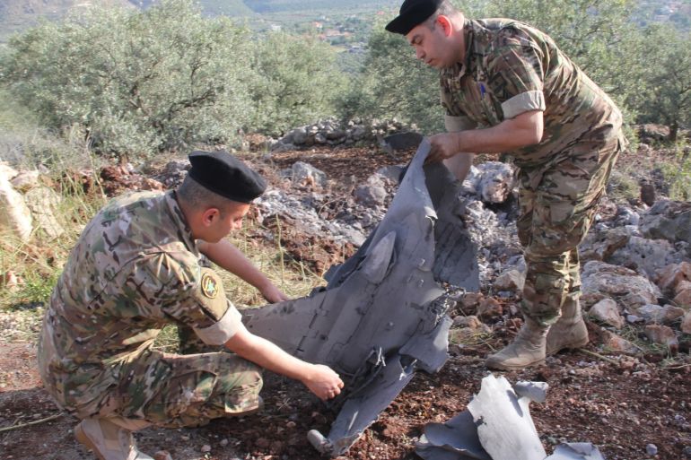 A rocket landed on Lebanese territory- - NABATIEH, LEBANON - MAY 10: Engineers of Lebanese security forces inspect a tailpiece of a rocket, which was launched during assaults between Israel and Syria, after it was landed on Hebbariye town of Hasbaya District of the Nabatieh Governorate in Lebanon on May 10, 2018.