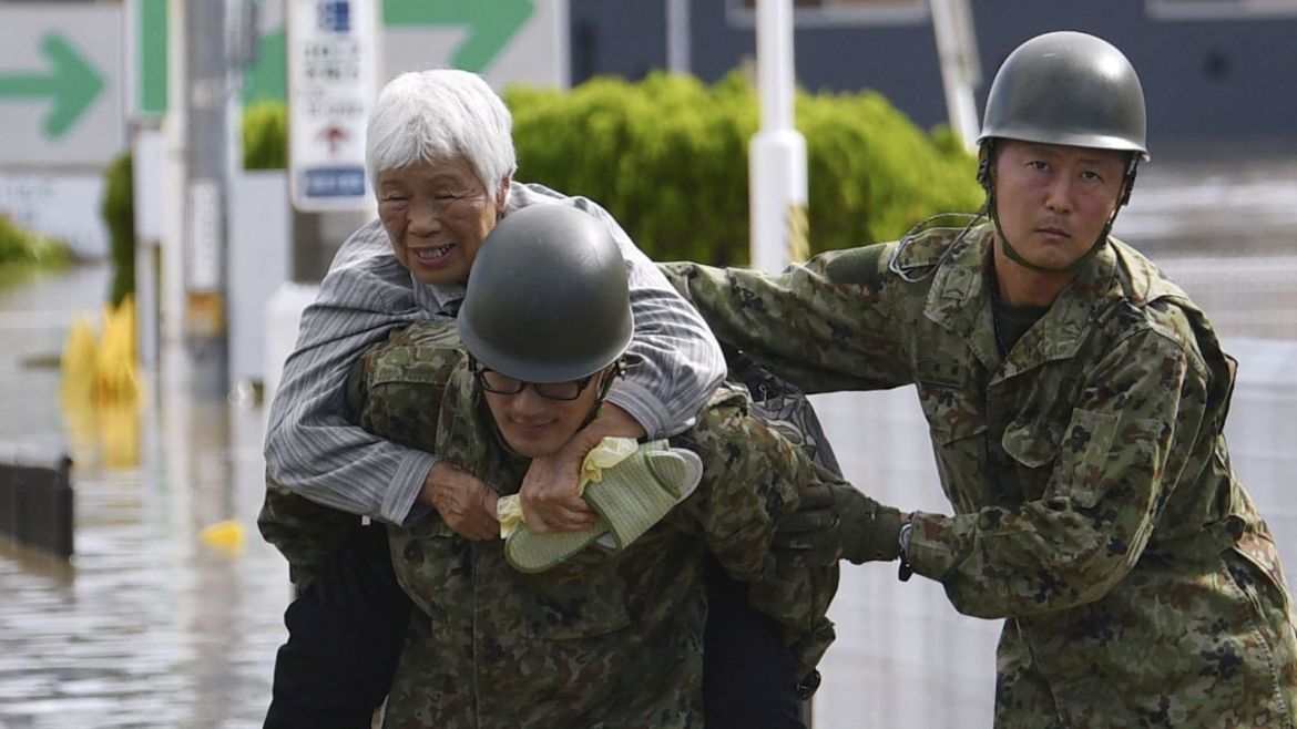 A local resident is rescued by Japanese Self-Defence Forces soldiers from areas flooded by Abukuma river following Typhoon Hagibis in Motomiya, Fukushima prefecture, Japan, October 13, 2019, in this photo taken by Kyodo. Mandatory credit Kyodo/via REUTERS ATTENTION EDITORS - THIS IMAGE WAS PROVIDED BY A THIRD PARTY. MANDATORY CREDIT. JAPAN OUT.