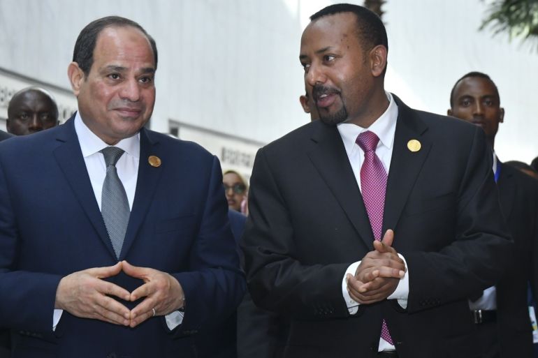 epa07358385 Egyptian President Abdel Fattah al-Sisi (L) and Prime Minister of Ethiopia Abiy Ahmed (R) chat during the 32nd African Union Summit in Addis Ababa, Ethiopia, 10 February 2019. African heads of state and business leaders are gathering in Ethiopian capital for a two-day summit under the theme 'Refugees, Returnees and Internally Displaced Persons: Towards Durable Solutions to Forced Displacement in Africa'. EPA-EFE/STRINGER