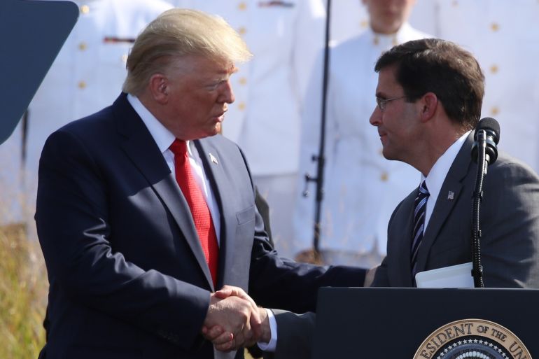 ARLINGTON, VIRGINIA - SEPTEMBER 11: U.S. President Donald Trump (L) shakes hands with Secretary of Defense Mark Esper during a 911 memorial ceremony at the Pentagon to commemorate the anniversary of the 9/11 terror attacks September 11, 2019 in Arlington, Virginia. The nation is marking the 18th anniversary of the terror attacks that took almost 3000 lives. Mark Wilson/Getty Images/AFP== FOR NEWSPAPERS, INTERNET, TELCOS & TELEVISION USE ONLY ==