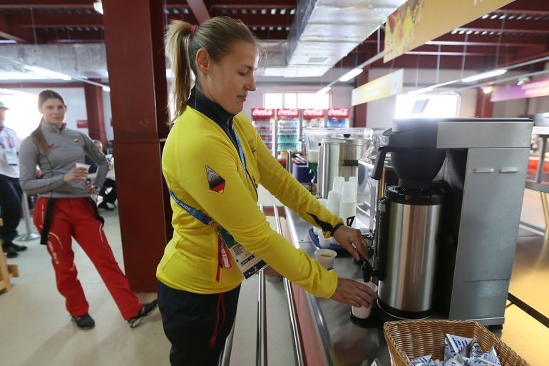 epa04054879 Germany Olympic Skeleton team athlete Anke Wichnewsketaki takes a coffee during her dinner the Mountain Olympic Village dinning room in Rosa Khutor, Russia, 04 February 2014. The Sochi 2014 Olympic Games kick off on February 07. EPA/SERGEI ILNITSKY