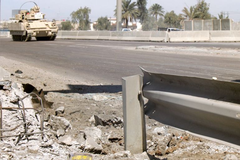 A U.S. tank patrols a road near the scene of a roadside bomb attack targeting Iraqi soldiers in Baghdad March 12, 2006. Two Iraqi soldiers were killed and four wounded when a roadside bomb went off near their patrol in central Baghdad, police said. REUTERS/Ceerwan Aziz