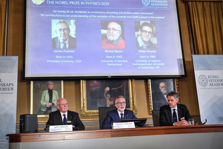 Goran K Hansson (C), Secretary General of the Royal Swedish Academy of Sciences, and academy members Mats Larsson (L) and Ulf Danielsson, announce winners of the 2019 Nobel Prize in Physics during a news conference at the Royal Swedish Academy of Sciences in Stockholm, Sweden, October 8, 2019. The 2019 Nobel Prize in Physics was awarded to James Peebles, Michel Mayor and Didier Queloz. Claudio Bresciani/TT News Agency/via REUTERS ATTENTION EDITORS - THIS IMAGE WAS