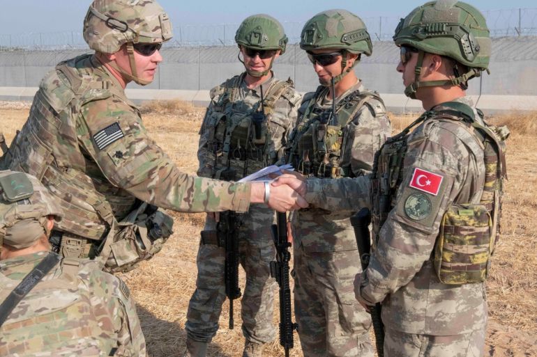 U.S. and Turkish military forces conduct a joint ground patrol inside the security mechanism area in northeast, Syria, October 4, 2019. Picture taken October 4, 2019. U.S. Army/Staff Sgt. Andrew Goedl/Handout via REUTERS. THIS IMAGE HAS BEEN SUPPLIED BY A THIRD PARTY.