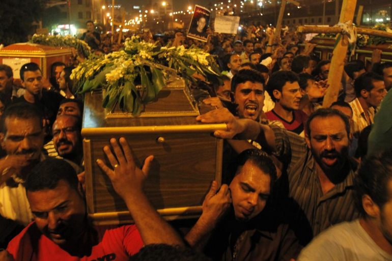 Egyptian Coptic Christians carry coffins as they make their way to Abassaiya Cathedral during a mass funeral for victims of sectarian clashes with soldiers and riot police, after a protest about an attack on a church in southern Egypt, in Cairo October 10, 2011. Egypt's Coptic Christians turned their fury against the army on Monday after at least 25 people were killed when troops broke up a protest, deepening public doubts about the military's ability to steer the cou