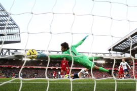 LIVERPOOL, ENGLAND - OCTOBER 27: Harry Kane of Tottenham Hotspur scores his team's first goal past Alisson Becker of Liverpool during the Premier League match between Liverpool FC and Tottenham Hotspur at Anfield on October 27, 2019 in Liverpool, United Kingdom. (Photo by Jan Kruger/Getty Images)