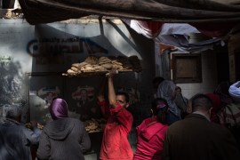CAIRO, EGYPT - DECEMBER 15: A man carries a tray of freshly baked bread through a crowd of customers outside a bread factory on December 15, 2016 in Cairo, Egypt. Bread prices are said to have tripled in past months. Since the 2011 Arab Spring, Egyptians have been facing a crisis, the uprising brought numerous political changes, but also economic turmoil, increased terror attacks and the unravelling of the once strong tourism sector. In recent weeks Egypt has again been hit by multiple bomb blasts, the most recent killed 26 Christians inside the St Peter and St Paul Church during Sunday mass. As Christians took to the streets chanting anti-government slogans, fears grow of an escalation in militant activity which would further deal damage to a country trying to rebuild. In recent months protests against rising fuel and food prices, calls for mass anti-government demonstrations and the continued terror attacks have seen Egyptian president Abdel Fattah Al-Sisi, suffer a significant drop in popularity. Mr. Al-Sisi has promised change, fearing anger and desperation could lead to popular unrest, however inflation currently sits at the highest level in seven years, jobless rates are above 13percent and more than 90million people are said to be living in poverty. The outlook forced the government to seek a $12 billion bailout from the International Monetary Fund, pushing the country to float the Egyptian pound to qualify for the loan. The move led to a sharp devaluation of the Egyptian pound which now sits at 18EGP to the dollar. The turmoil is affecting not only the poor but both the middle-class and the wealthy as food and commodity prices skyrocket. (Photo by Chris McGrath/Getty Images)