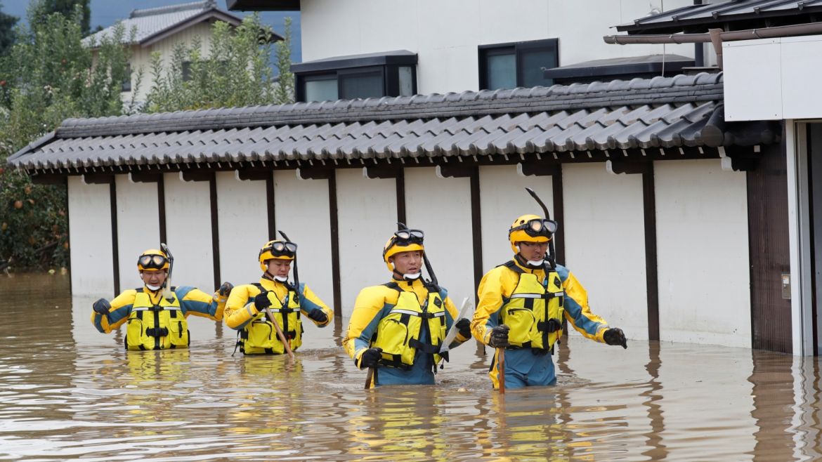 Police search a flooded area in the aftermath of Typhoon Hagibis, which caused severe floods at the Chikuma River in Nagano Prefecture, Japan, October 14, 2019. REUTERS/Kim Kyung-Hoon