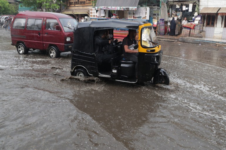 epa07940706 Egyptians ride a three-wheeler rickshaw (toktok) during rain shower in Cairo, Egypt, 22 October 2019. According to reports, showers are hitting Cairo as temperatures reach 21 degrees Celsius. EPA-EFE/KHALED ELFIQI