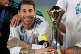 Soccer Football - FIFA Club World Cup Final - Real Madrid vs Gremio FBPA - Zayed Sports City Stadium, Abu Dhabi, United Arab Emirates - December 16, 2017 Real Madrid’s Sergio Ramos celebrates with the trophy after winning the FIFA Club World Cup REUTERS/Matthew Childs