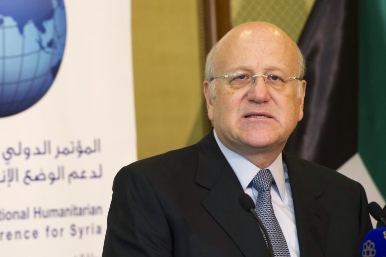 Lebanon's caretaker Prime Minister Najib Mikati attends a news conference at the opening session of the Syrian Donors Conference at Bayan Palace Liberation Hall in Kuwait City January 15, 2014. Western and Gulf Arab nations pledged $1.4 billion on Wednesday for United Nations aid efforts in Syria, where an almost three-year-old civil war has left millions of people hungry, ailing or displaced. REUTERS/Stephanie McGehee (KUWAIT - Tags: POLITICS)