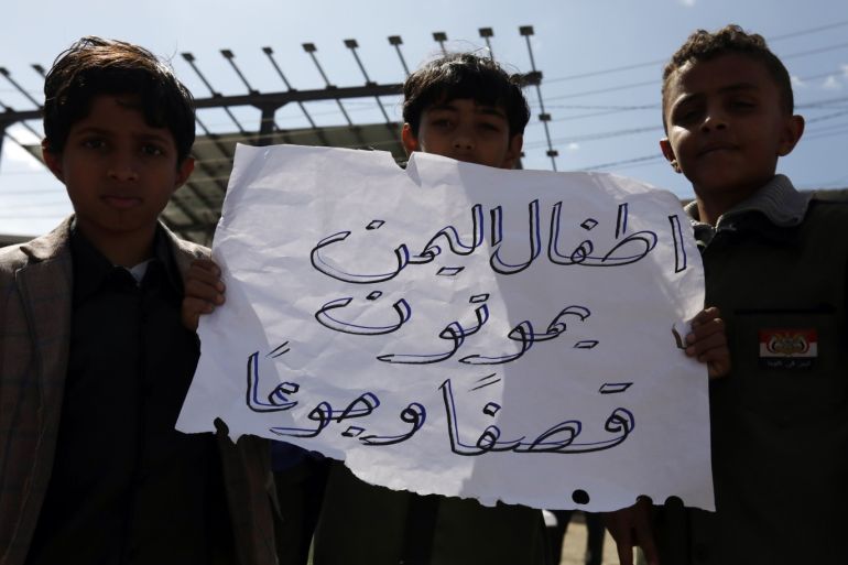 A Yemeni schoolboy holds a placard reading in Arabic 'Yemeni children die of airstrikes and starvation' during a protest on World Children's Day, outside the UN offices in Sanaa, Yemen, 20 November 2019. World Children's Day is observed every year on 20 November to promote awareness among children worldwide and improving children's welfare. EPA-EFE/YAHYA ARHAB