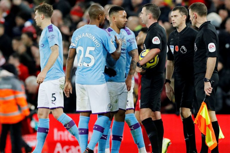 Soccer Football - Premier League - Liverpool v Manchester City - Anfield, Liverpool, Britain - November 10, 2019 Manchester City's Gabriel Jesus is held back by Fernandinho as he remonstrates with referee Michael Oliver after the match REUTERS/Phil Noble EDITORIAL USE ONLY. No use with unauthorized audio, video, data, fixture lists, club/league logos or