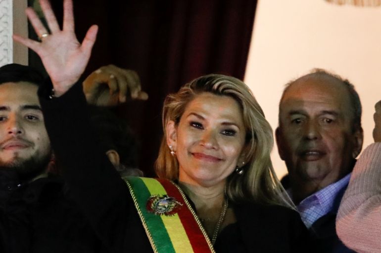 Bolivian Senator Jeanine Anez gestures after she declared herself as Interim President of Bolivia, at the balcony of the Presidential Palace, in La Paz, Bolivia November 12, 2019. REUTERS/Marco Bello