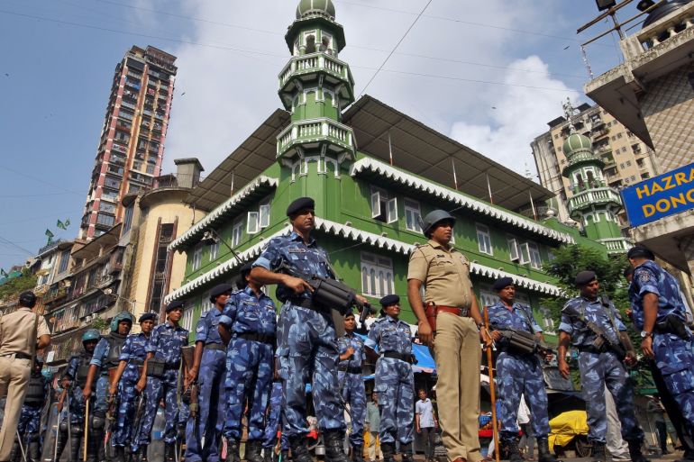 Rapid Action Force (RAF) personnel stand guard outside a mosque before Supreme Court's verdict on a disputed religious site in Ayodhya, in Mumbai, India November 9, 2019. REUTERS/Prashant Waydande