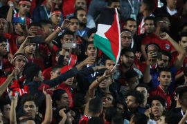Soccer Football - Africa Under 23 Cup of Nations - Semi Final - Egypt U23 v South Africa U23 - Cairo International Stadium, Cairo, Egypt - November 19, 2019 General view as a flag of Palestine is waved by an Egypt fan inside the stadium during the match REUTERS/Amr Abdallah Dalsh