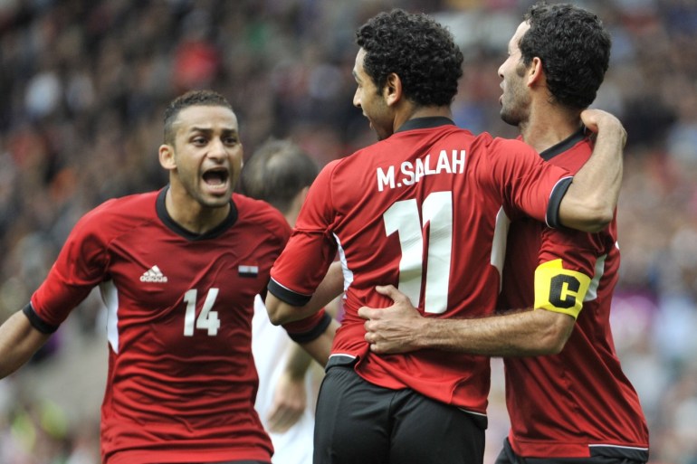 MANCHESTER, UNITED KINGDOM - JULY 29: Mohamed Salah of Egypt celebrates scoring his goal with team mates during the Men's Football first round Group C Match between Egypt and New Zealand on Day 2 of the London 2012 Olympic Games at Old Trafford on July 29, 2012 in Manchester, England. (Photo by Francis Bompard/Getty Images)