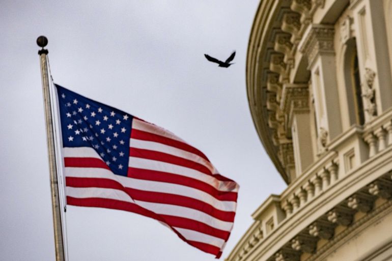 WASHINGTON, DC - OCTOBER 30: An American flag flies at the U.S. Capitol on October 30, 2019 in Washington, DC. State Department special adviser for Ukraine Catherine Croft and State Department official Christopher Anderson are expected to appear for closed-door depositions as part of the impeachment inquiry and the latest in a line of career diplomats who have complied with a House subpoena. Samuel Corum/Getty Images/AFP== FOR NEWSPAPERS, INTERNET, TELCOS & TELEVISION USE ONLY ==