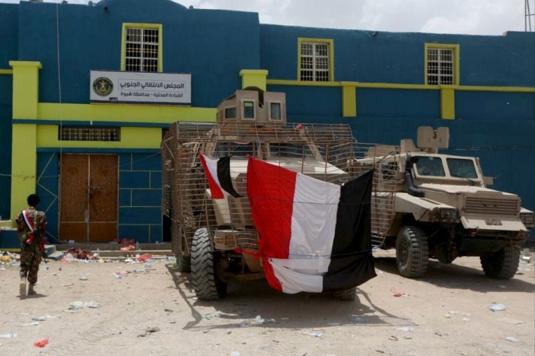 Armored military vehicles used by UAE-backed southern separatist fighters are seen outside the headquarters of the separatist Southern Transitional Council, taken by government forces during the recent clashes, in Ataq, Yemen August 27, 2019. REUTERS/Ali Owidha