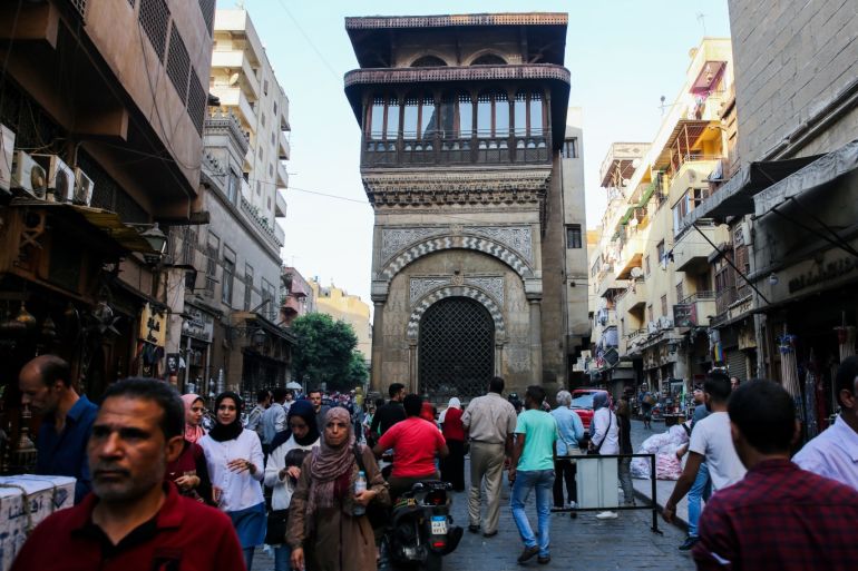 Open-Air Museum at Muizz Street in Cairo- - CAIRO, EGYPT - OCTOBER 05 : People walk in the Al Moez Ldin Allah Al Fatimi Street (Muizz Street), which hosts an open-air museum where historical structures from Ottoman Empire and Mamluk Sultanate are found, in Cairo, Egypt on October 05, 2018. Open-air museum includes domed Mosques, old trade centers, madrasahs (educational institution), fountains with its location close to Al-Azhar University, Al-Hussein Mosque and Khan El-Khalili bazaar.
