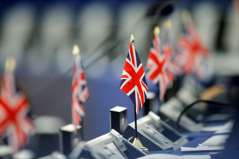 British Union Jack flags are seen on the desks of Members of the Brexit Party during a debate on the last European summit, at the European Parliament in Strasbourg, France, July 4, 2019. بريطانيا REUTERS/Vincent Kessler