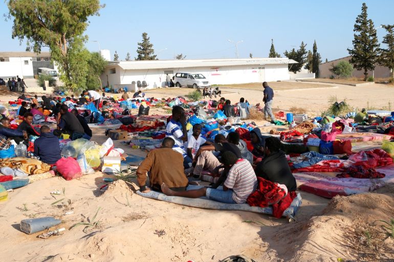 Migrants are seen with their belongings at a detention centre for mainly African migrants that was hit by an airstrike, in the Tajoura suburb of Tripoli, Libya July 3, 2019. REUTERS/Ismail Zitouny