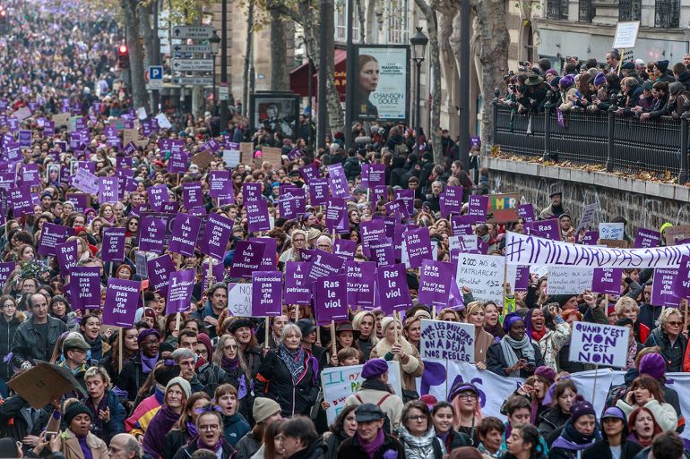 epa08020118 Women rights activists hold placards with Purple signs adopted by the feminist movement 'Nous Toutes' (All of Us) as they march during a rally against femicide, gender-based violence and sexual harassment against women, in Paris, France, 23 November 2019. EPA-EFE/CHRISTOPHE PETIT TESSON