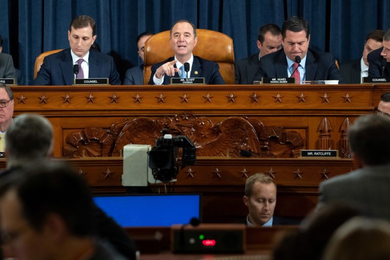 Chairman Adam Schiff (C), Democrat of California, speaks alongside Ranking Member Devin Nunes (2nd R), Republican of California, during the first public hearings held by the House Permanent Select Committee on Intelligence as part of the impeachment inquiry into U.S. President Donald Trump, with witnesses Ukrainian Ambassador William Taylor and Deputy Assistant Secretary George Kent testifying, on Capitol Hill in Washington, DC, U.S., November 13, 2019. Saul Loeb/Pool via REUTERS