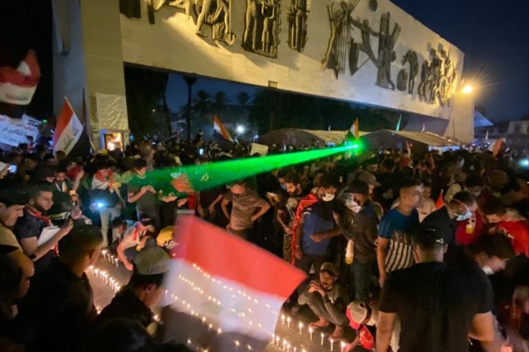 Anti government protests in Iraq- - BAGHDAD, IRAQ - NOVEMBER 02: Protestors light candles as they attend ongoing anti-government demonstrations at Tahrir Square in Iraq's capital Baghdad on November 02, 2019.