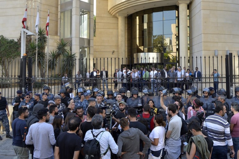 epa07990224 Protesters block the main entrance of the Beirut Bar Association during ongoing anti-government protests in Beirut, Lebanon, 12 November 2019. Protesters demand the president to make parliamentary consultations immediately in order to fac
