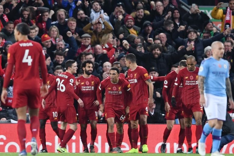 LIVERPOOL, ENGLAND - NOVEMBER 10: Mohamed Salah of Liverpool celebrates with teammates after scoring his team's second goal during the Premier League match between Liverpool FC and Manchester City at Anfield on November 10, 2019 in Liverpool, United Kingdom. (Photo by Laurence Griffiths/Getty Images)