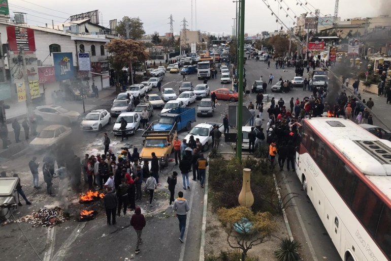 Protest against gasoline price hike in Iran- - TEHRAN, IRAN - NOVEMBER 16: Protesters set fire as they block the roads during a protest against gasoline price hike at Damavand of Tehran, Iran on November 16, 2019.