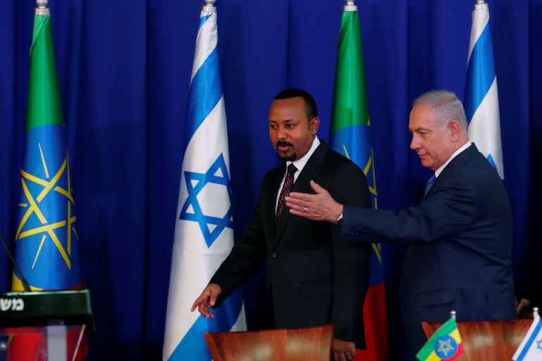 Israeli Prime Minister Benjamin Netanyahu gestures as he stands next to his Ethiopian counterpart Abiy Ahmed before they deliver joint statements during their meeting in Jerusalem September 1, 2019. REUTERS/Ronen Zvulun