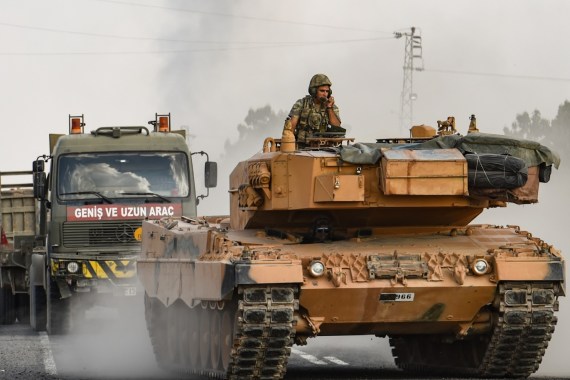 CEYLANPINAR, TURKEY - OCTOBER 18: A Turkish army tank moves towards the Syrian border on October 18, 2019 in Ceylanpinar, Turkey. Turkish forces appeared to continue shelling targets in Northern Syria despite yesterday's announcement, by U.S. Vice President Mike Pence, that Turkey had agreed to a ceasefire in its assault on Kurdish-held towns near its border. (Photo by Burak Kara/Getty Images)