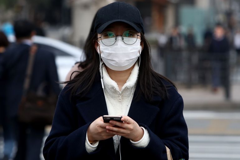 SEOUL, SOUTH KOREA - MARCH 06: A woman wearing mask walks during a polluted day on March 06, 2019 in Seoul, South Korea. Most of South Korea was blanketed by extraordinarily heavy levels of choking fine dust air pollution for the sixth consecutive day and forecasters say the condition is unlikely to improve for the time being. (Photo by Chung Sung-Jun/Getty Images)