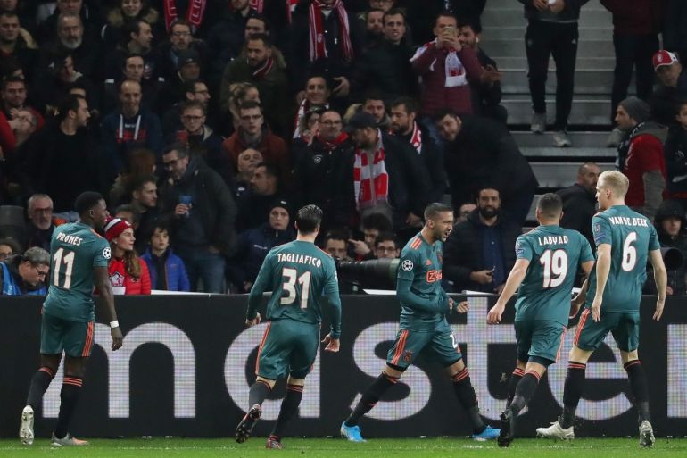 Soccer Football - Champions League - Group H - Lille v Ajax Amsterdam - Stade Pierre-Mauroy, Lille, France - November 27, 2019 Ajax's Hakim Ziyech celebrates scoring their first goal with teammates REUTERS/Yves Herman