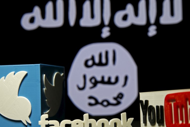 A 3D plastic representation of the Twitter and Youtube logo is seen in front of a displayed ISIS flag in this photo illustration in Zenica Bosnia and Herzegovina February 3 2016. Iraq is trying to persuade satellite firms to halt Internet services in areas under Islamic State's rule seeking to deal a major blow to the group's potent propaganda machine which relies heavily on social media to inspire its followers to wage jihad. Picture taken February 3 2016. To match Insight MIDEAST-CRISIS/IRAQ-INTERNET REUTERS/Dado Ruvic TPX IMAGES OF THE DAY