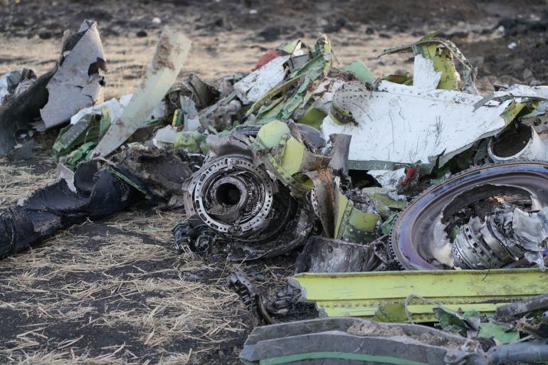BISHOFTU, ETHIOPIA - MARCH 11: Parts of an engine and the landing gear lay in a pile after being gathered by workers during the continuing recovery efforts at the crash site of Ethiopian Airlines flight ET302 on March 11, 2019 in Bishoftu, Ethiopia. Flight 302 was just six minutes into its flight to Nairobi, Kenya when it crashed, killing all 157 passengers and crew on board on March 10. As a result of the crash, Ethiopia joined China and other countries in grounding