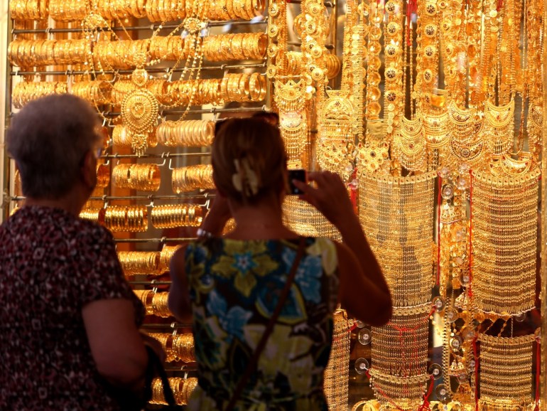 DUBAI, UNITED ARAB EMIRATES - SEPTEMBER 25: Visitors are pictured at the Dubai Gold Souk on September 25, 2014 in Dubai, United Arab Emirates. (Photo by Warren Little/Getty Images)
