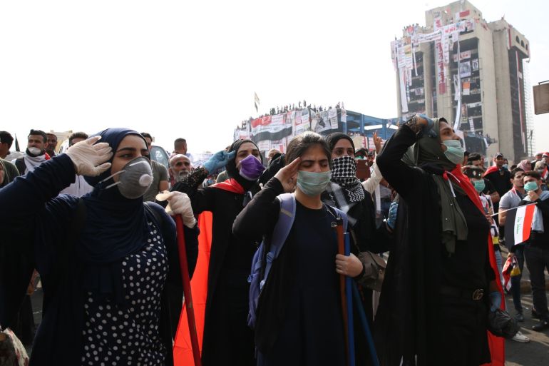 ‘Turkish Restaurant Building’ becomes symbolic landmark for Iraqi demonstrators- - BAGHDAD, IRAQ - NOVEMBER 02: Iraqi demonstrators are seen around the 14-storey abandoned building that generally called generally called as “Turkish restaurant building” among Iraqi people, during anti-government protests at Tahrir Square in Baghdad, Iraq on November 02, 2019. ‘Turkish Restaurant Building’ becomes symbolic and strategically landmark for Iraqi demonstrators for their security. The structure has been abandoned when it was bombed by the U.S.-led forces in their invasion in 2003. But it has now been taken over from security forces by demonstrators since October 25. Iraqi demonstrators hang a giant Iraqi flag and posters of those who were killed in protests.