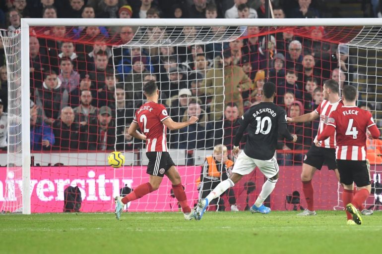 SHEFFIELD, ENGLAND - NOVEMBER 24: Marcus Rashford of Manchester United scores his sides third goal during the Premier League match between Sheffield United and Manchester United at Bramall Lane on November 24, 2019 in Sheffield, United Kingdom. (Photo by Michael Regan/Getty Images)