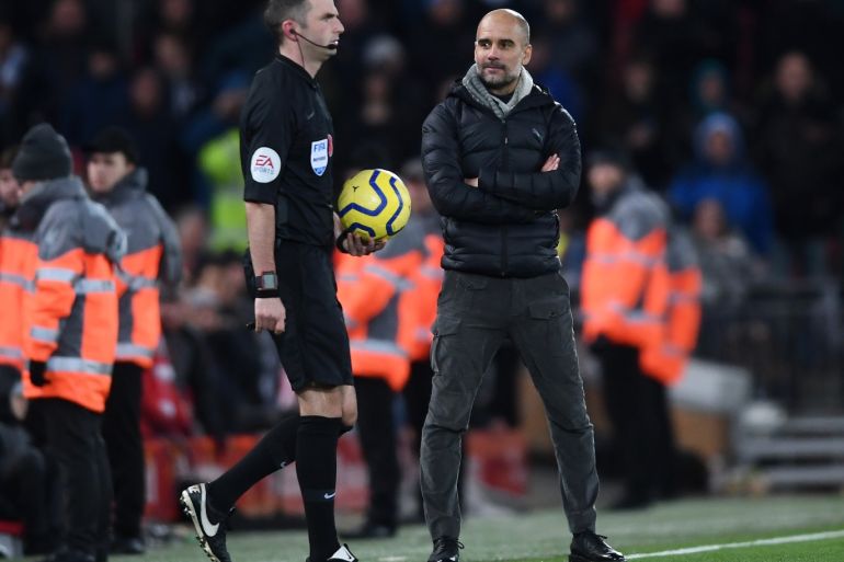 LIVERPOOL, ENGLAND - NOVEMBER 10: Pep Guardiola, Manager of Manchester City stares at referee Michael Oliver as he walks onto the pitch for the second halfduring the Premier League match between Liverpool FC and Manchester City at Anfield on November 10, 2019 in Liverpool, United Kingdom. (Photo by Laurence Griffiths/Getty Images)