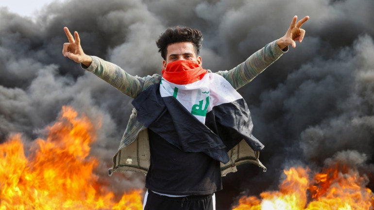 An Iraqi demonstrator gestures during the ongoing anti-government protests in Najaf, Iraq November 18, 2019. REUTERS/Alaa al-Marjani