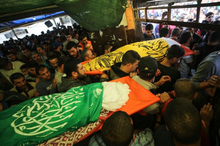 Israeli airstrike hit Gaza Strip- - GAZA CITY, GAZA - NOVEMBER 13: (EDITOR'S NOTE: Image depicts death) People attend the funeral ceremony of a Palestinian Raafat Ayyad and his kids Islam Ayyad and Emir Ayyad, who were killed by Israeli airstrikes over Zeitoun, at Hassan Al Banna Mosque in Gaza City, Gaza on November 13, 2019.